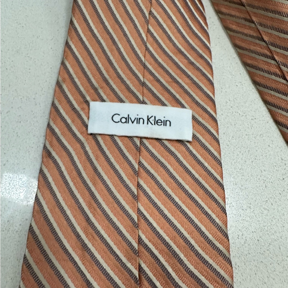 Calvin Klein men’s silk striped orange and brown tie